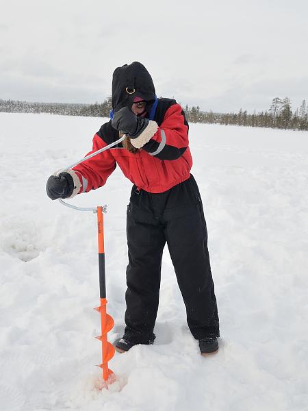 Finland0111.jpg - Ice fishing on a frozen lake in Lapland