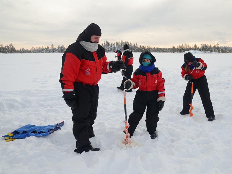 Finland0112.jpg - Ice fishing on a frozen lake in Lapland