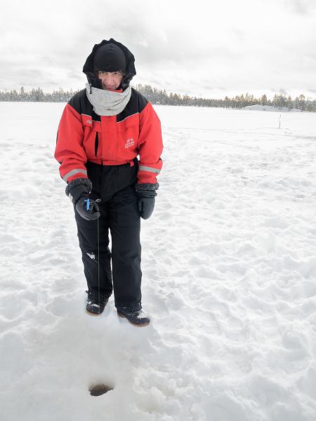 Finland0113.jpg - Ice fishing on a frozen lake in Lapland