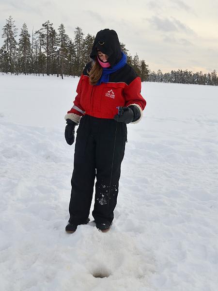 Finland0114.jpg - Ice fishing on a frozen lake in Lapland