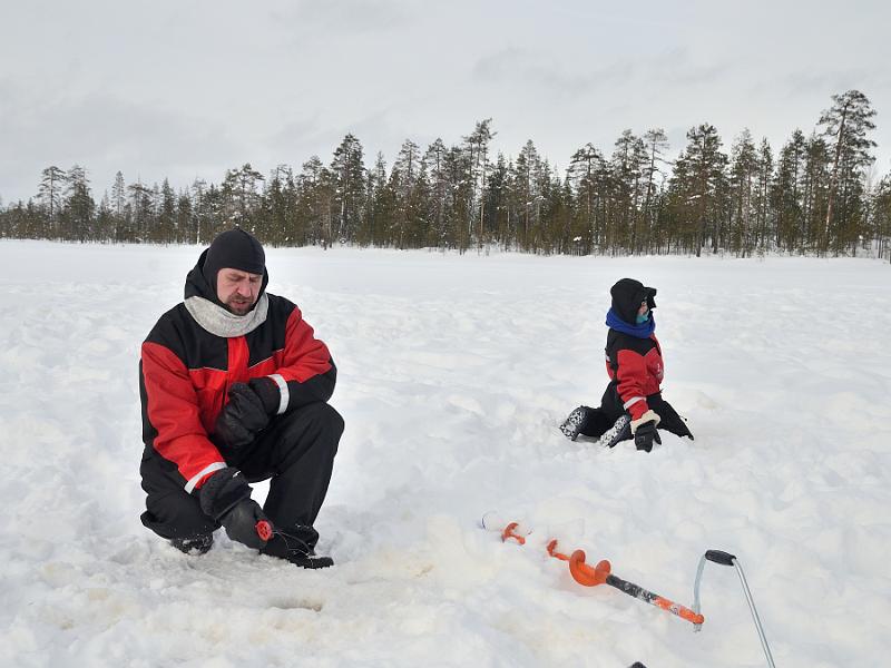 Finland0115.jpg - Ice fishing on a frozen lake in Lapland