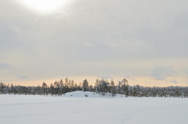 Finland0116.jpg - Ice fishing on a frozen lake in Lapland