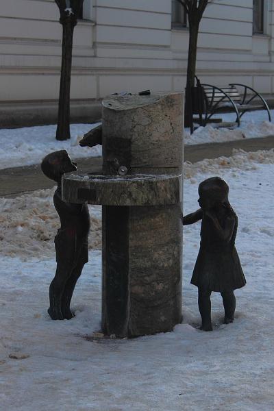 poland175.JPG - Drinking Fountain Decorated By Sculptures Of Kids And A Catfish On  Piotrkowska Street