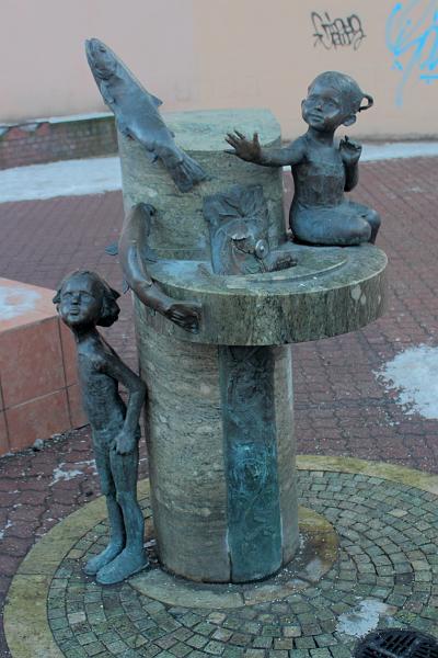 poland180.JPG - Drinking Fountain Decorated By Sculptures Of Kids And A Catfish On Piotrkowska Street